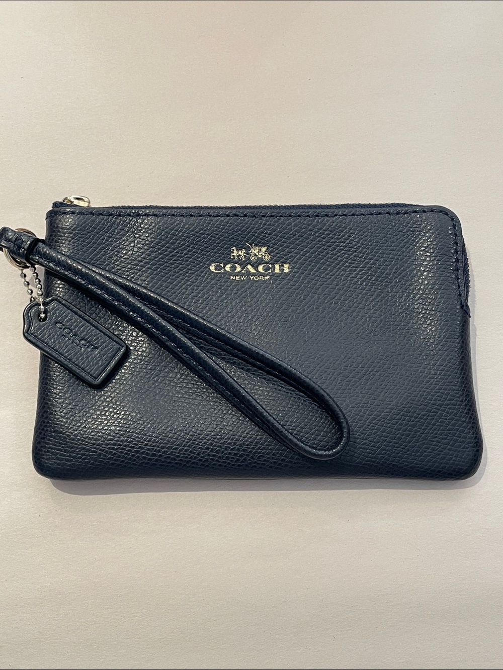 Coach Navy Pebbled Leather Wristlet with Gold Logo